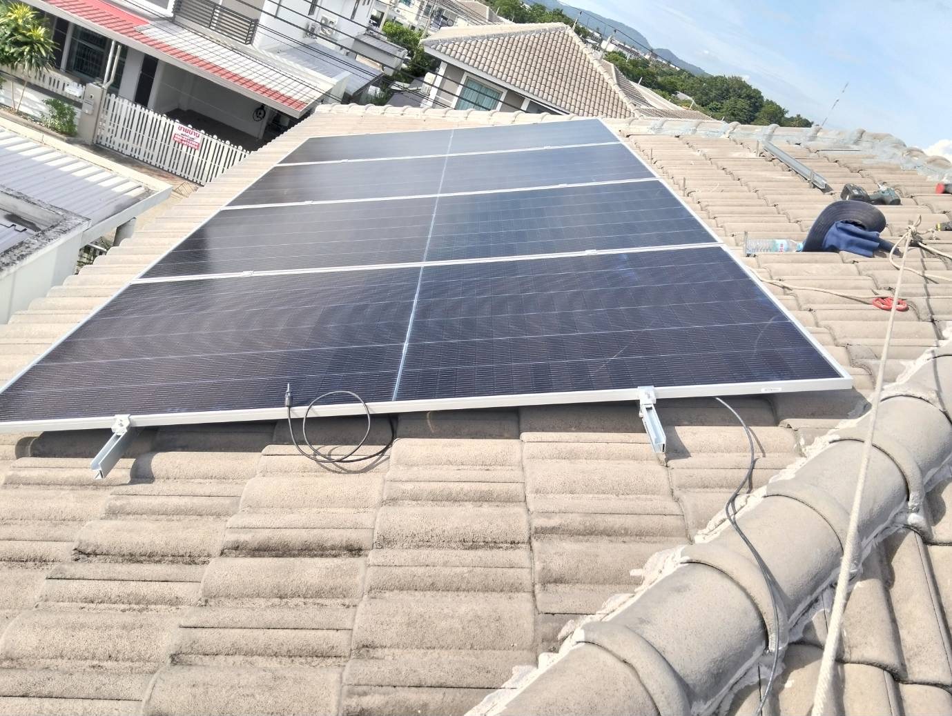 Rooftop solar panel array on a residential tile roof